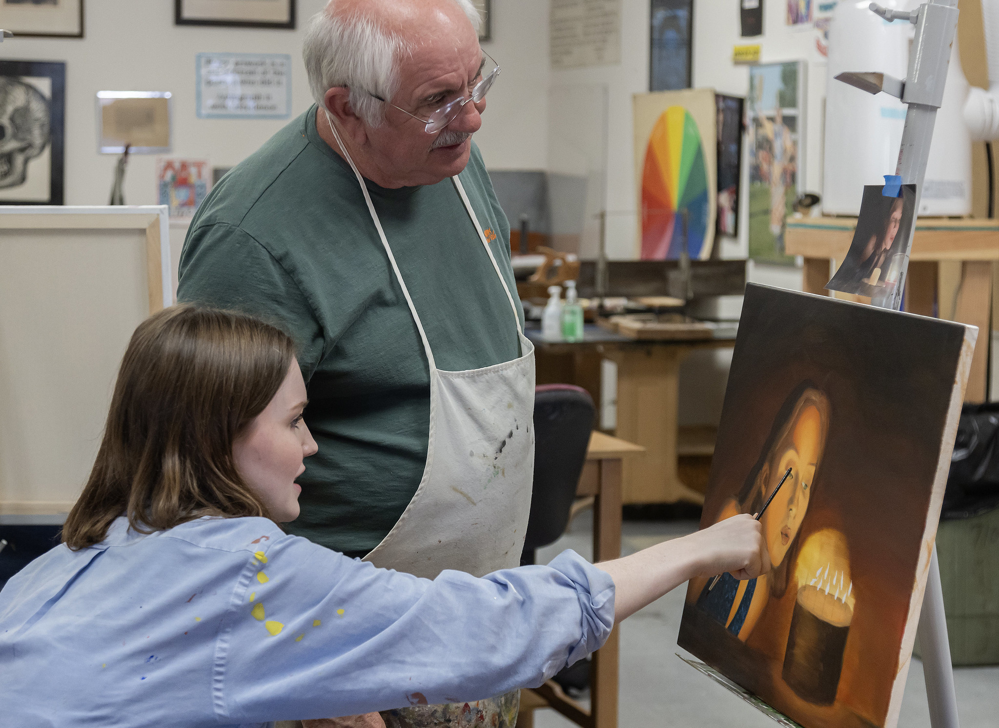 art student with painting professor