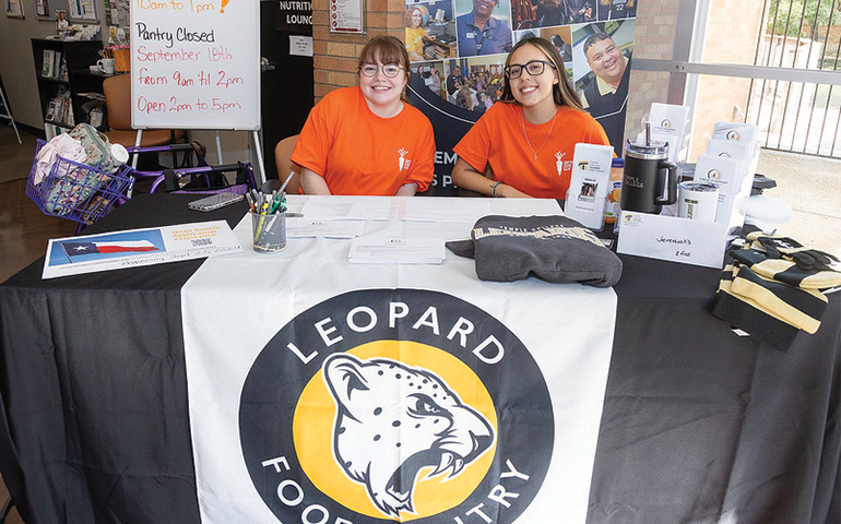 Leopard food pantry workers welcome students
