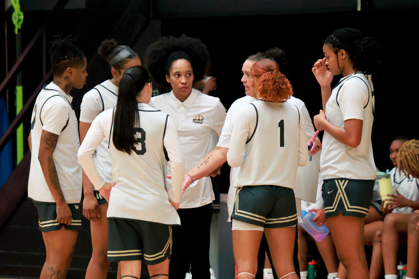 TC women's basketball huddles during a timeout.