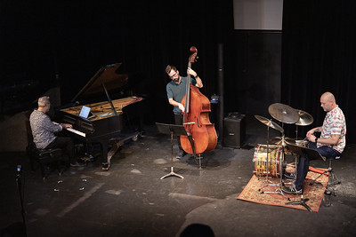 Members of the Temple College Music Faculty playing piano, base, and percussion