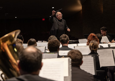Dr. Glen Brumbach directing the Temple College Symphonic Band as seen by the performers