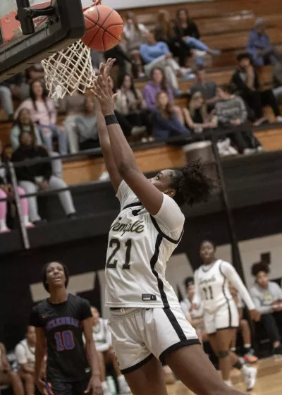 Basketball player shooting basket