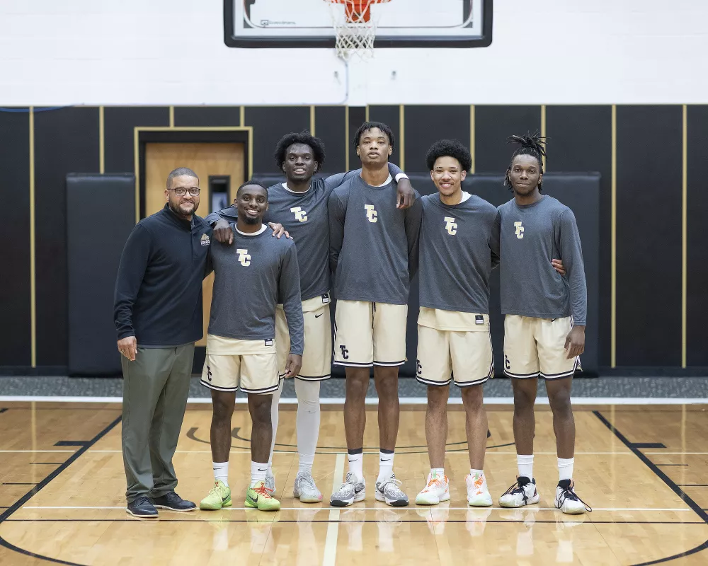 Sophomore basketball players with coach