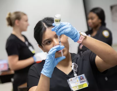 Student filling syringe